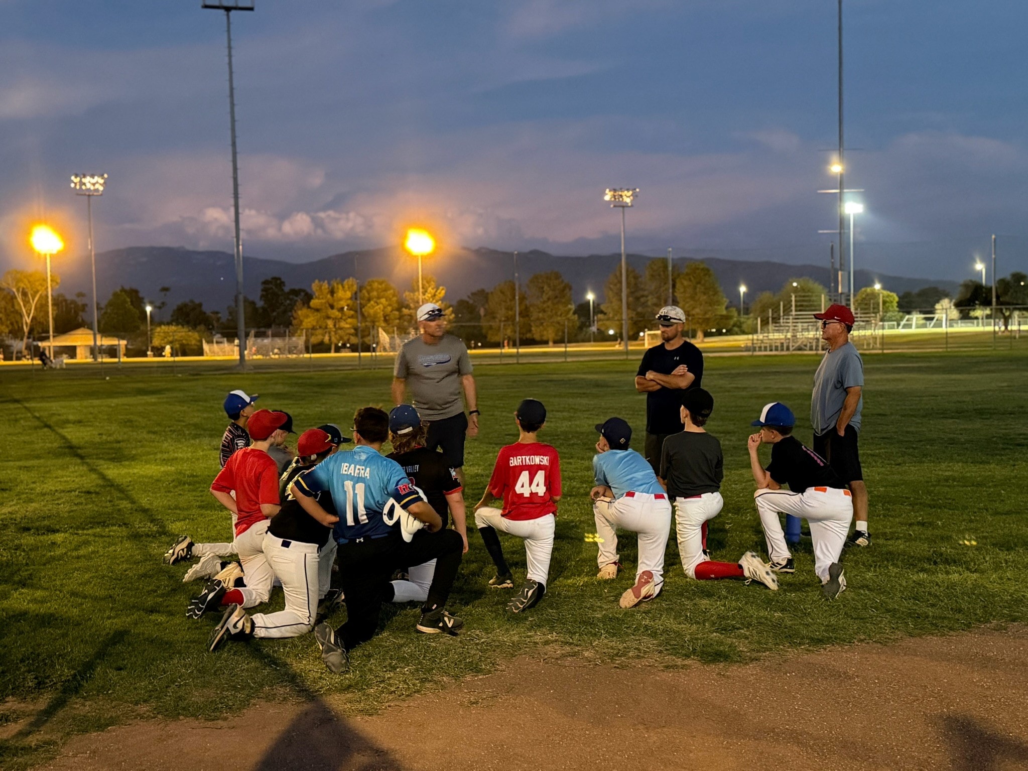 Tanque Verde Titans team gathering at dusk
