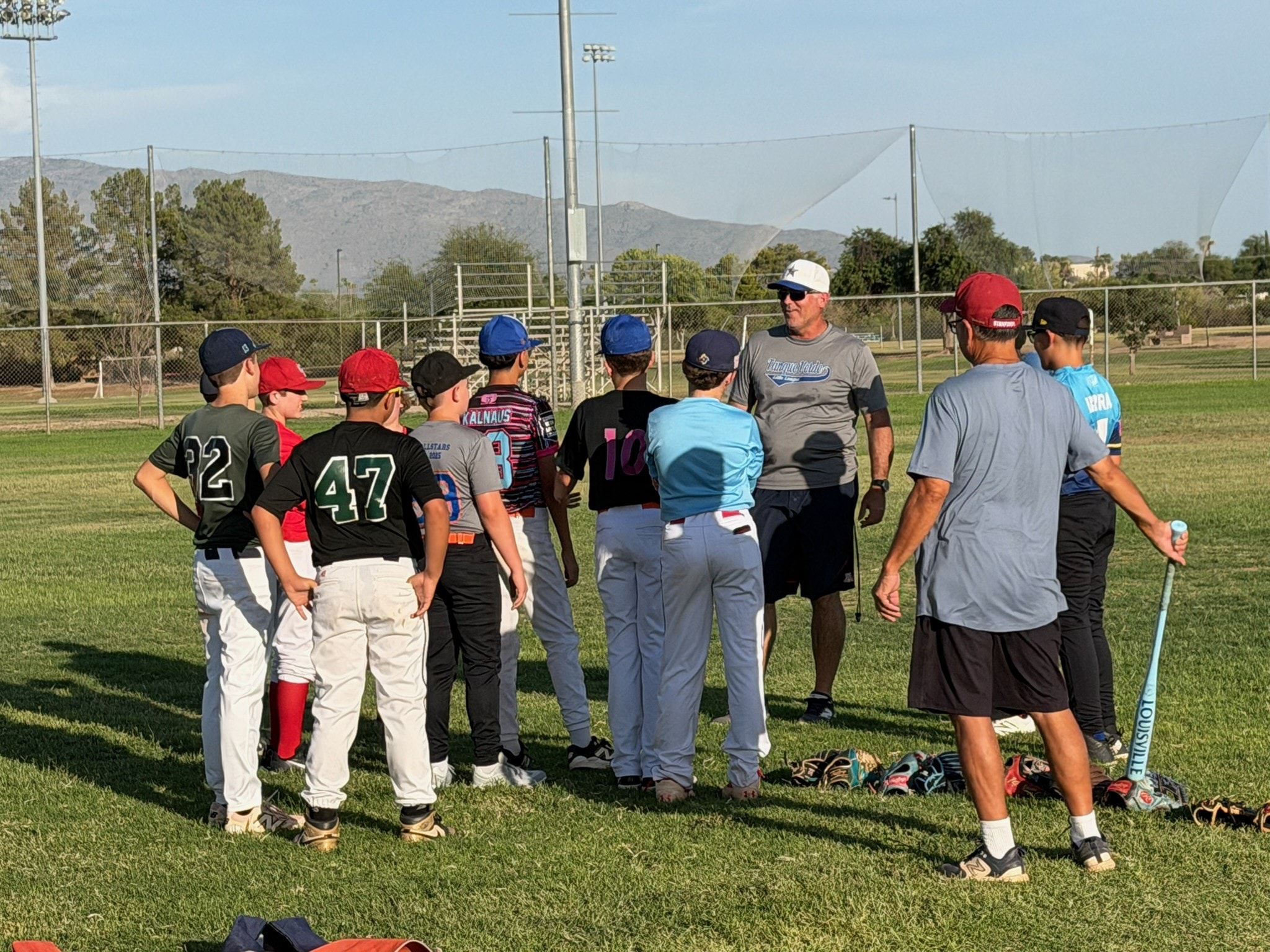 Tanque Verde Titans team huddle with coach